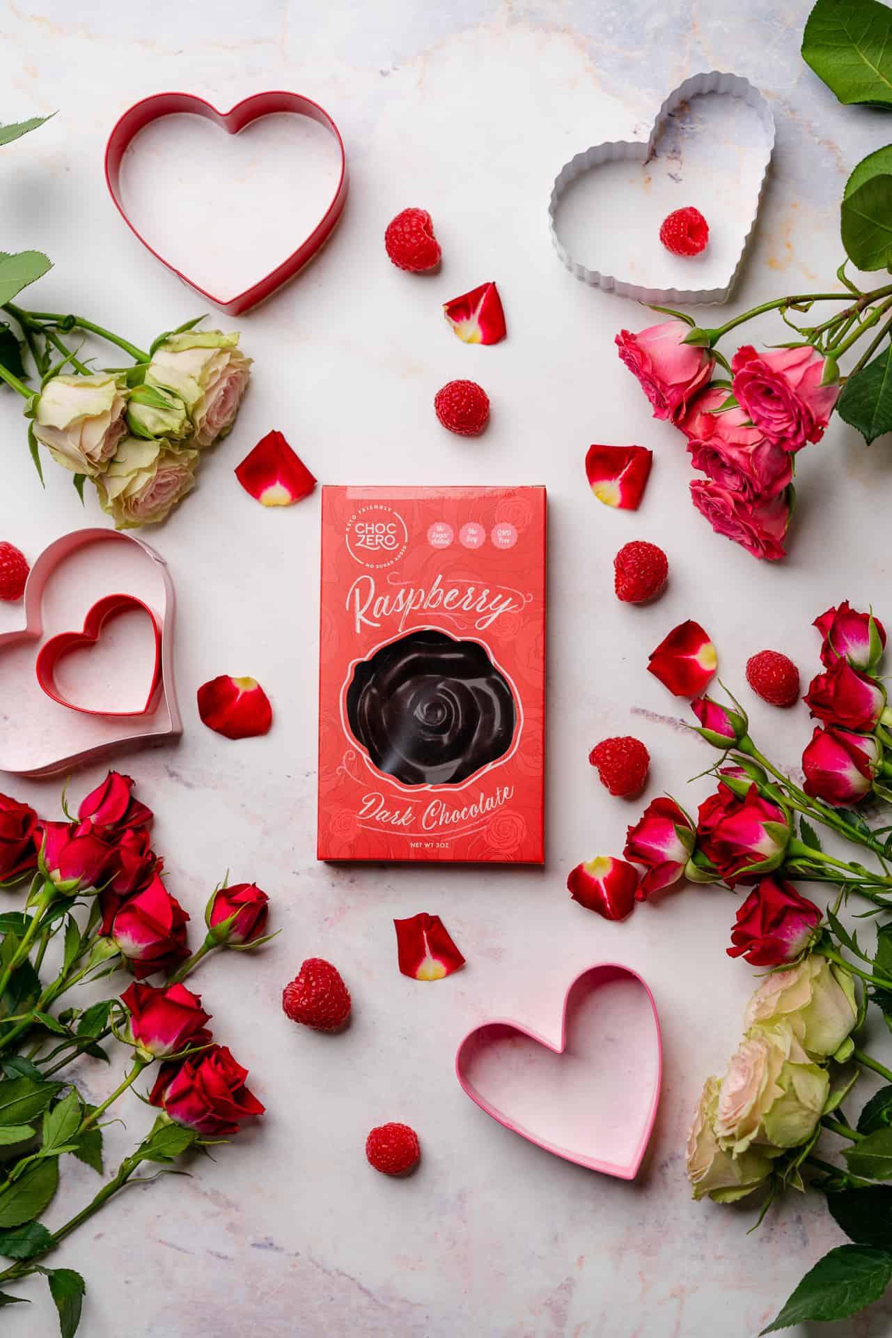 Choc Zero raspberry dark chocolate bars with roses and valentine's day props