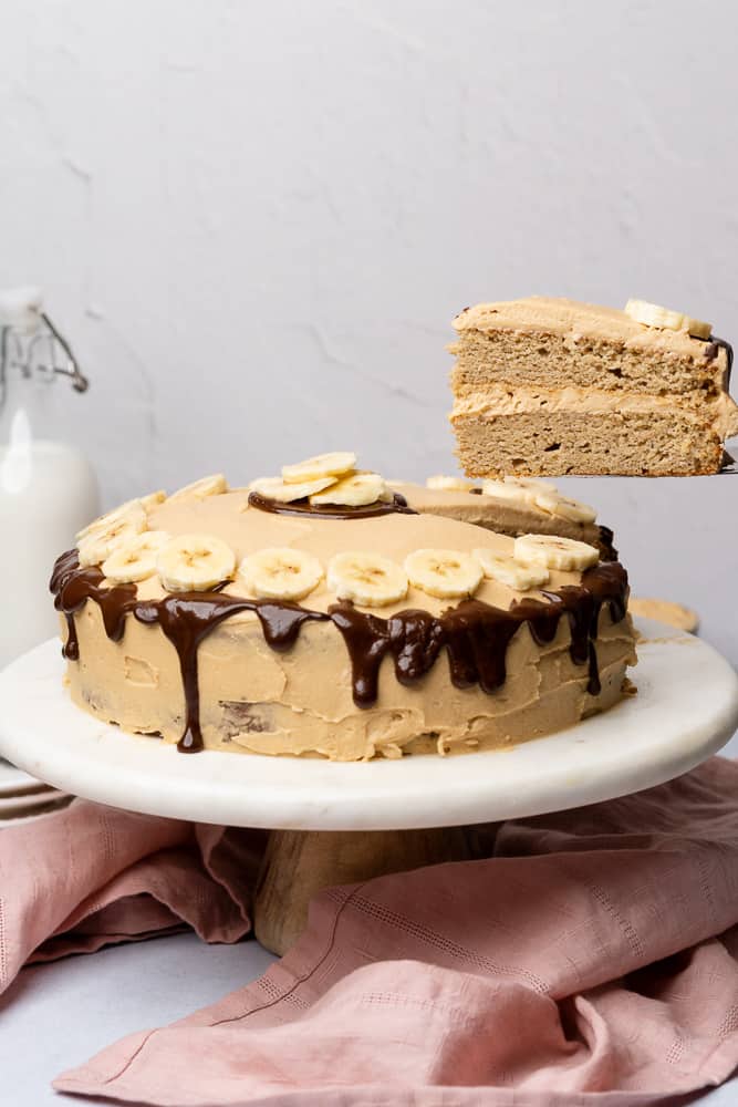 banana dream cake with a slice being lifted out 
