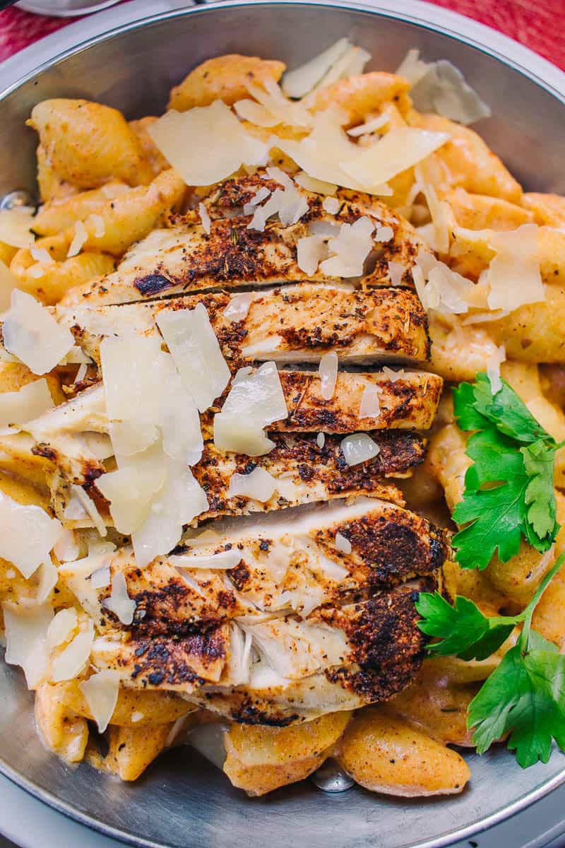 spicy cajun chicken alfredo with parmesan shreds and parsley