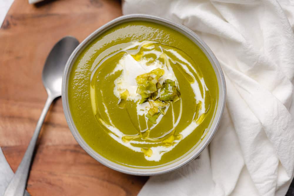 closeup shot of a bowl of green potato leek kale soup