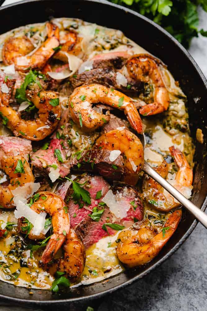 steak and seafood skillet with shrimp in a cast iron skillet