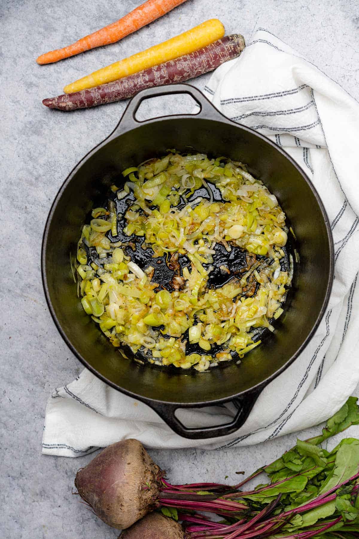 cooking leeks in a cast iron dutch oven