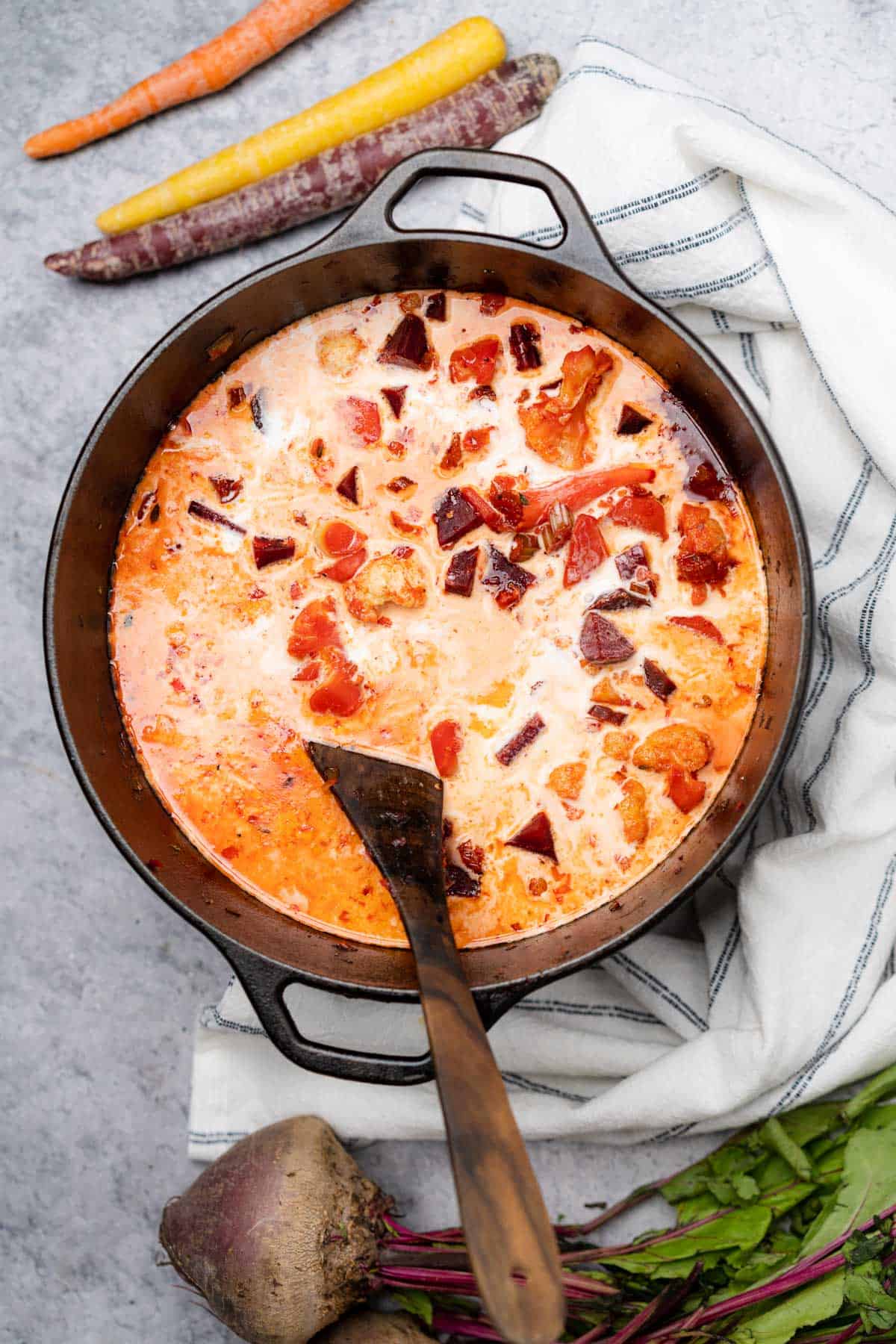 heavy cream with carrot and beet soup in  cast iron dutch oven