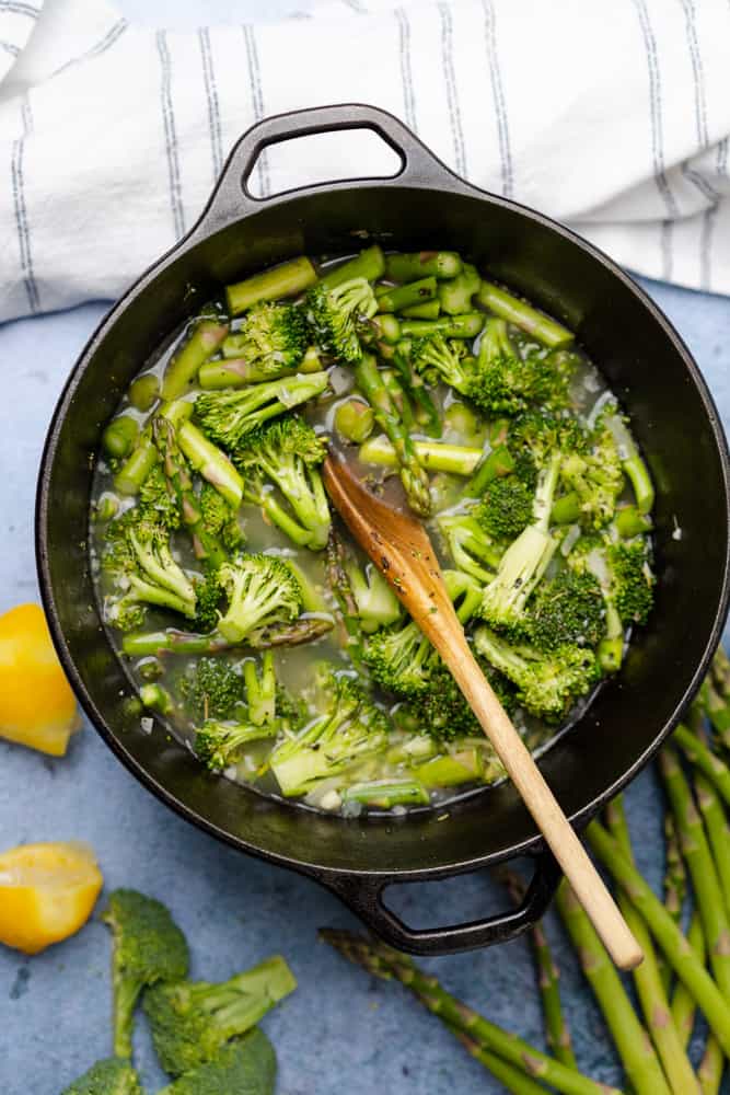 broccoli and asparagus in a cast iron dutch oven