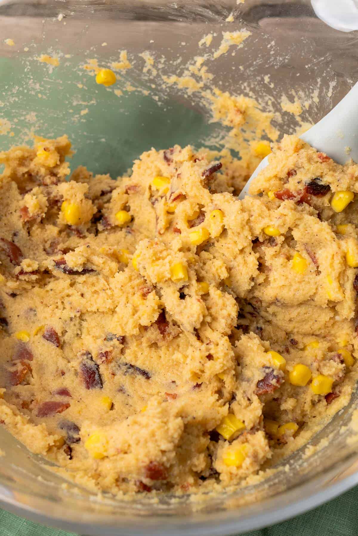 mixing together brown butter bacon cornbread batter together