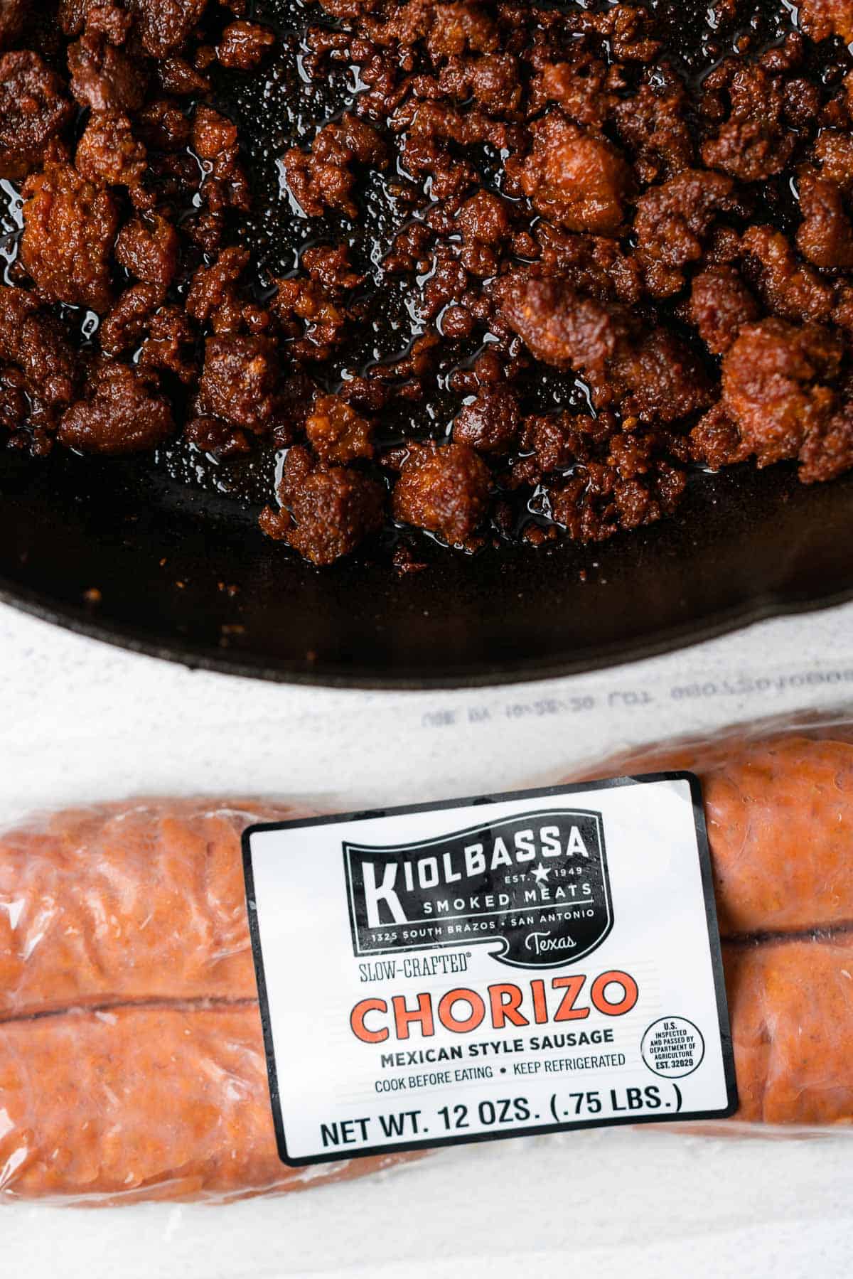 kiolbassa smoked meats chorizo raw in the package and cooked in a cast iron skillet