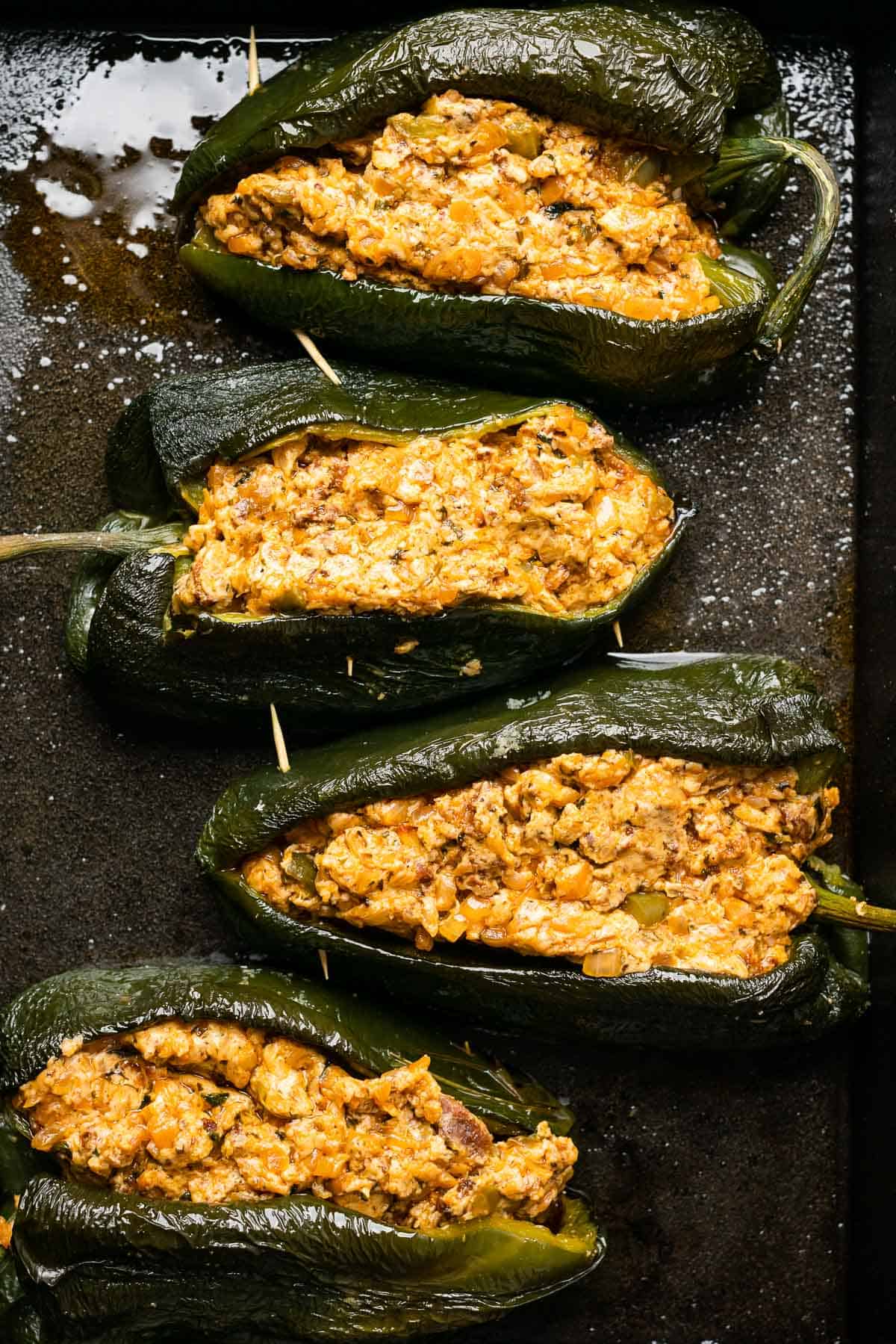 poblano peppers stuffed with cheesy chorizo sour cream mixture and secured with toothpicks