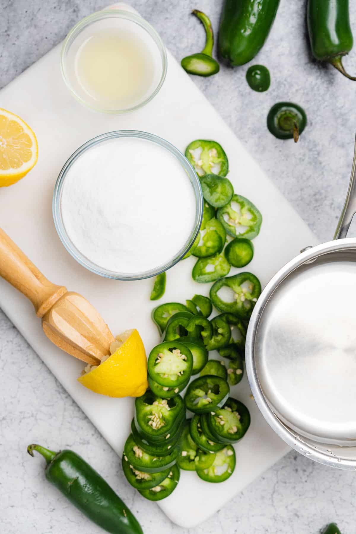 ingredients fo jalapeno simple syrup with lemons allulose water and fresh jalapenos