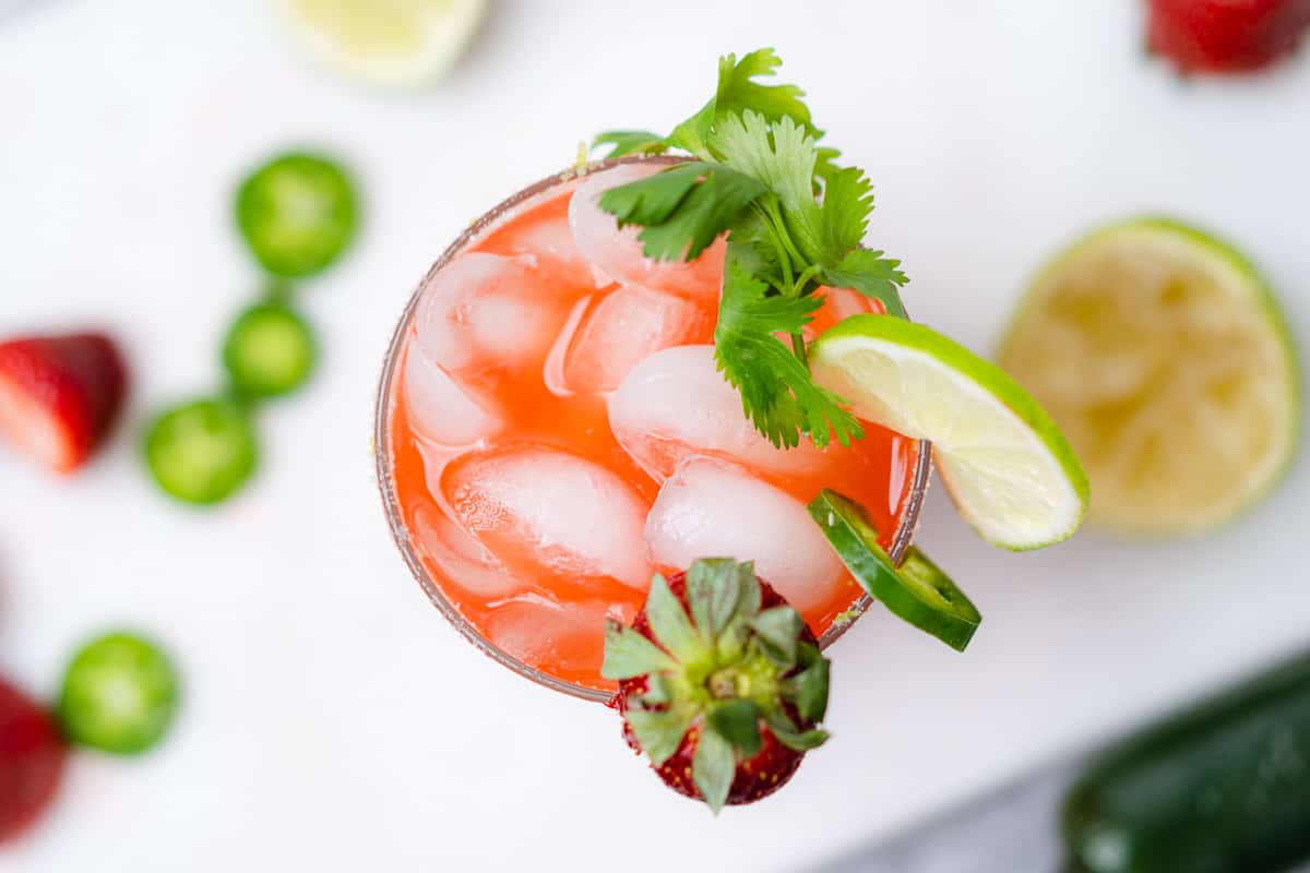 overhead view of a strawberry jalapeno margarita