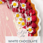 White Chocolate Raspberry Tart - Keto and Gluten Free graphic with text of a photo of the tart with fresh raspberries white chocolate ganache and chamomile flowers