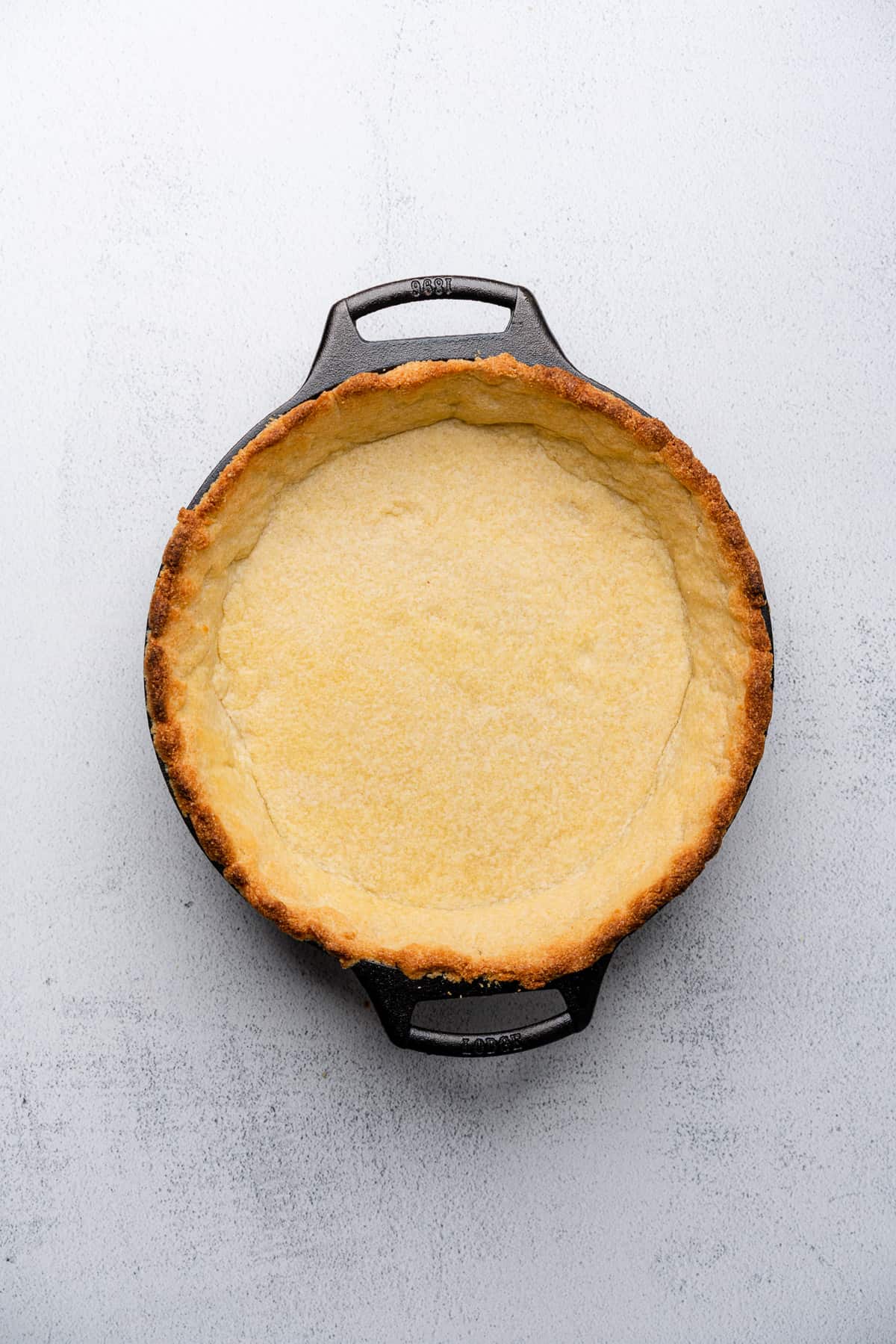 browned edges of a pie crust in a cast iron skillet 