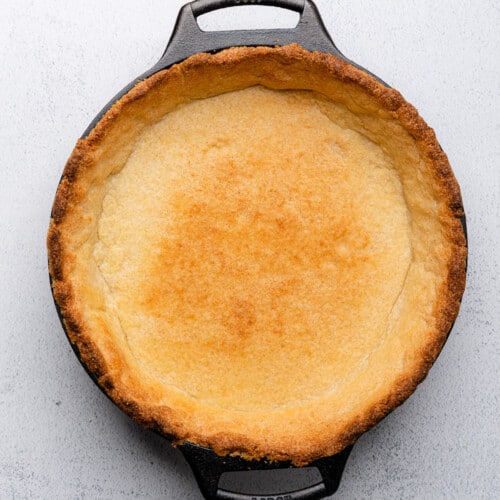gluten free pie crust browned in a cast iron skillet
