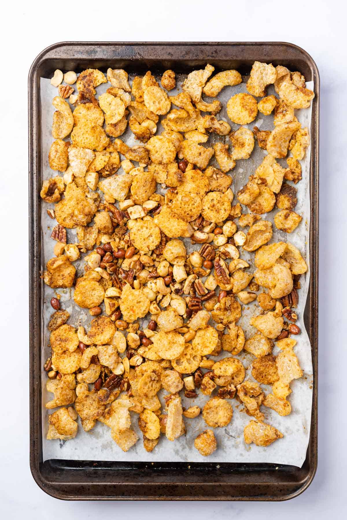 tray of snack mix on a baking sheet