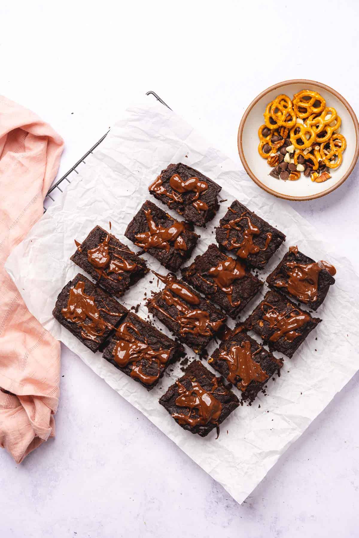 drizzling keto brownies with chocolate ganache