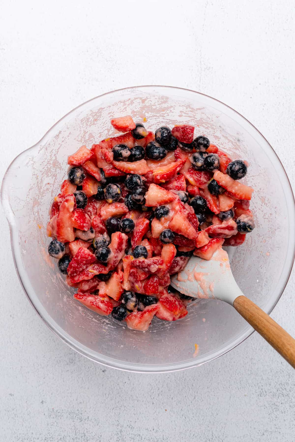 berries tossed with thickeners and sweetener to go into a low carb strawberry blueberry pie