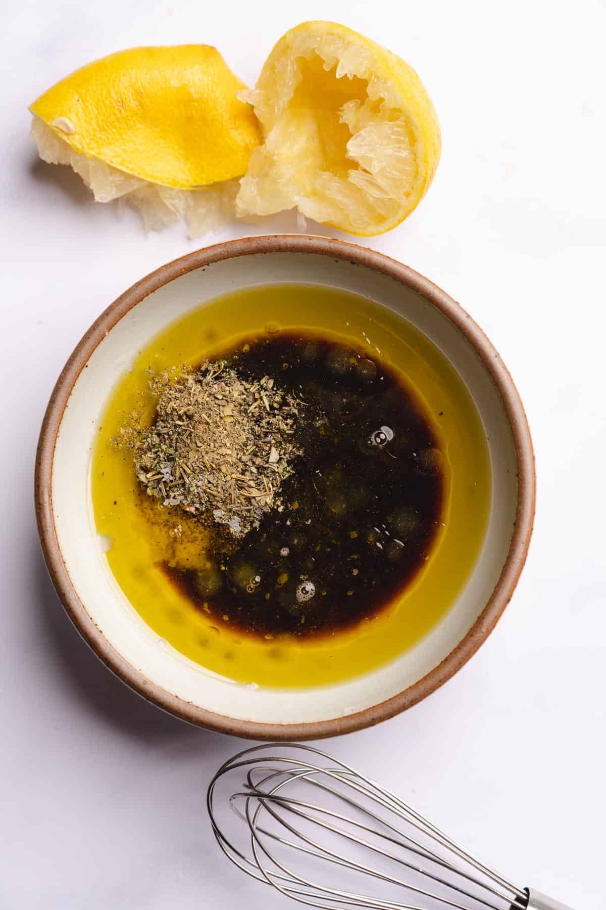 olive oil, lemon juice, balsamic vinegar, salt, pepper and italian seasoning in a bowl