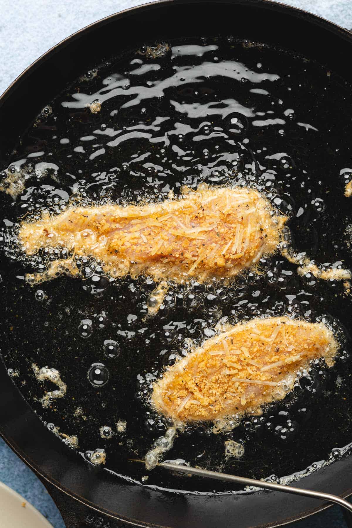 chicken tenders frying in hot oil