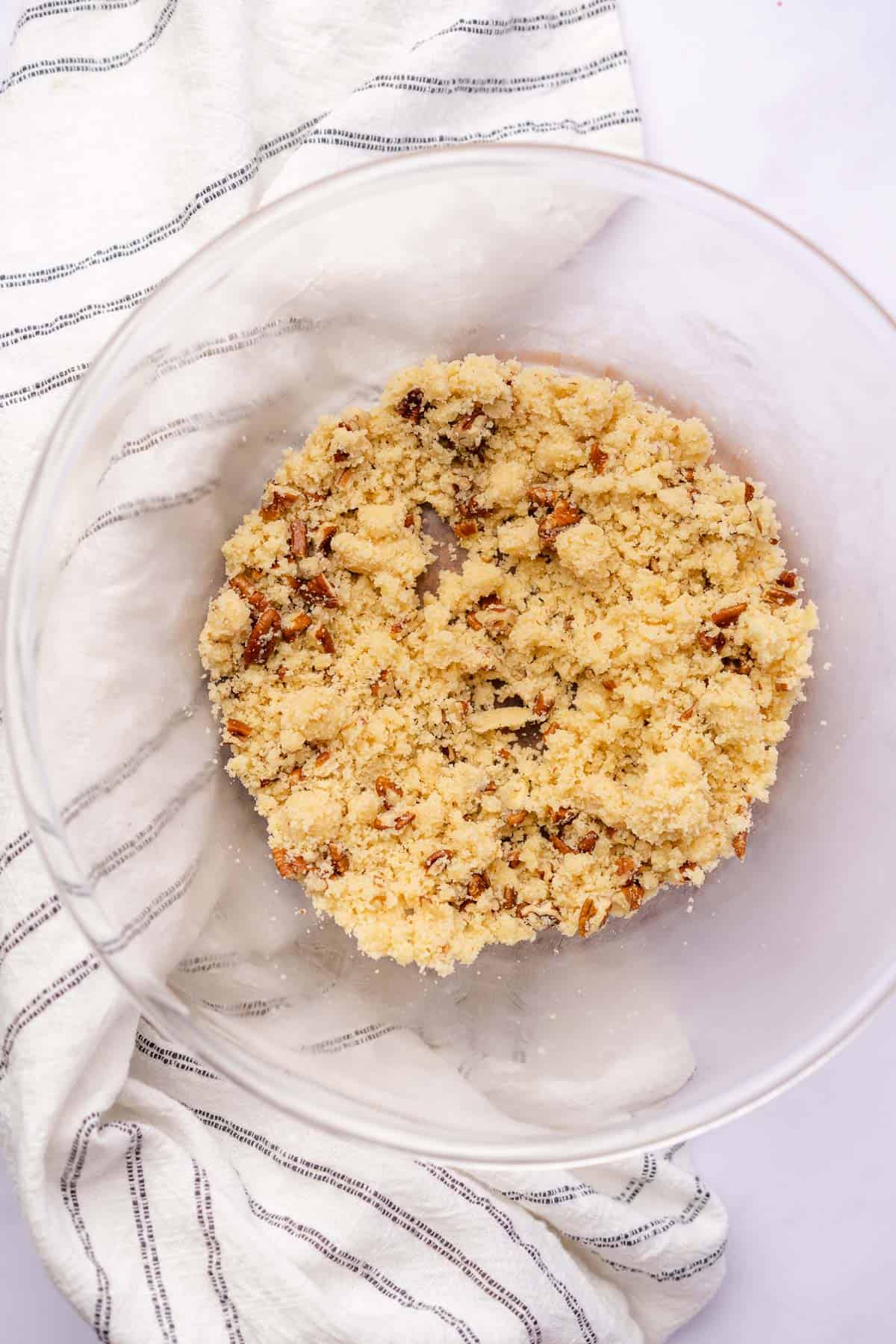 gluten free almond flour crumble topping in a bowl with pecans