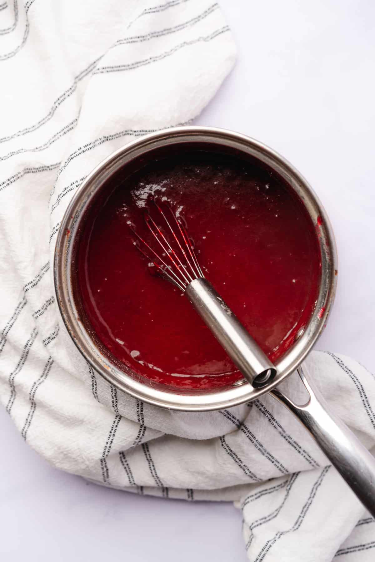 plum sauce for gluten free plum bars in a sauce pan, thickened for use