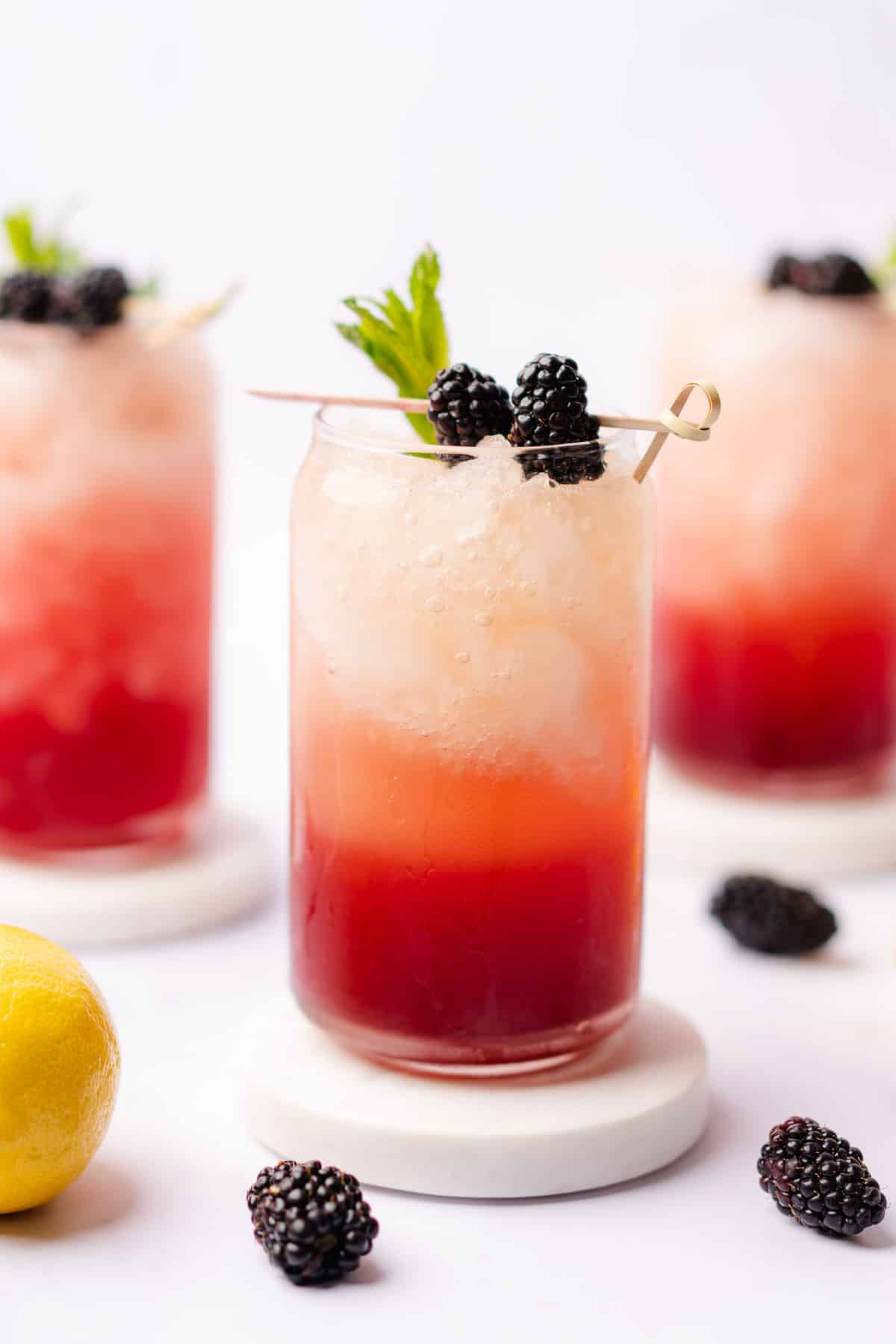 gorgeous sugar free blackberry bourbon bramble with fresh berries mint and lemon
