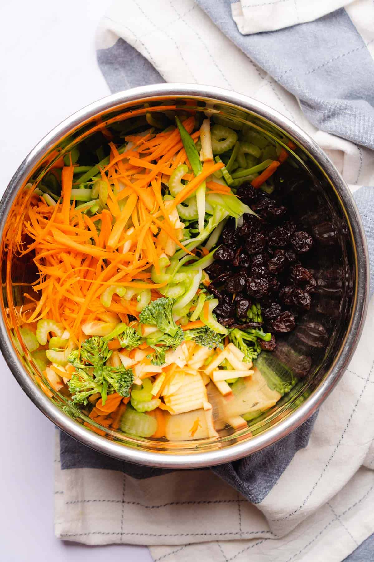 carrots, apples, dried cherries, celery and broccolini in a large bowl