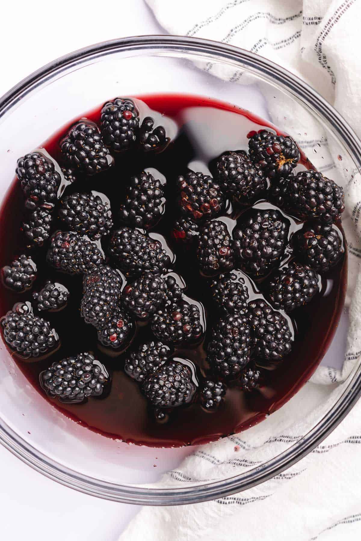 blackberries in a bowl full of red wine