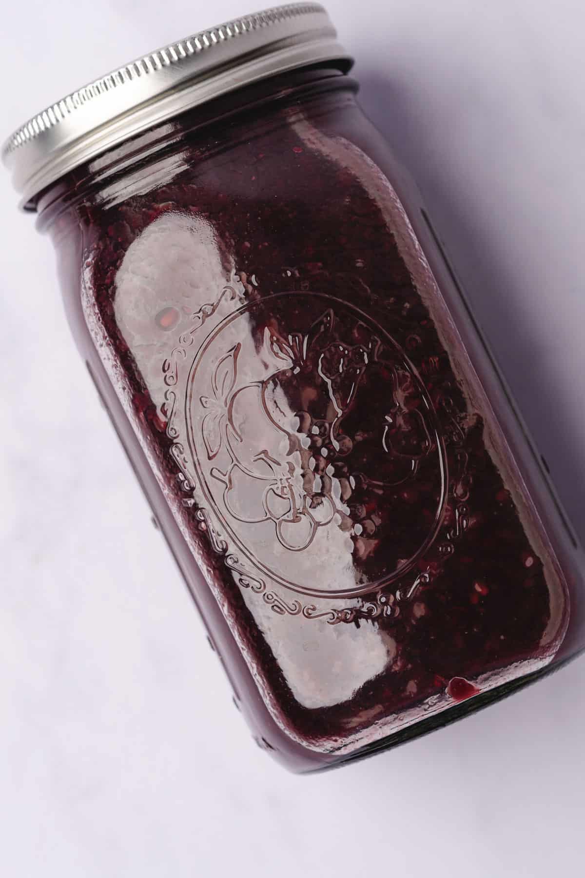 mashed blackberries and red wine in a mason jar