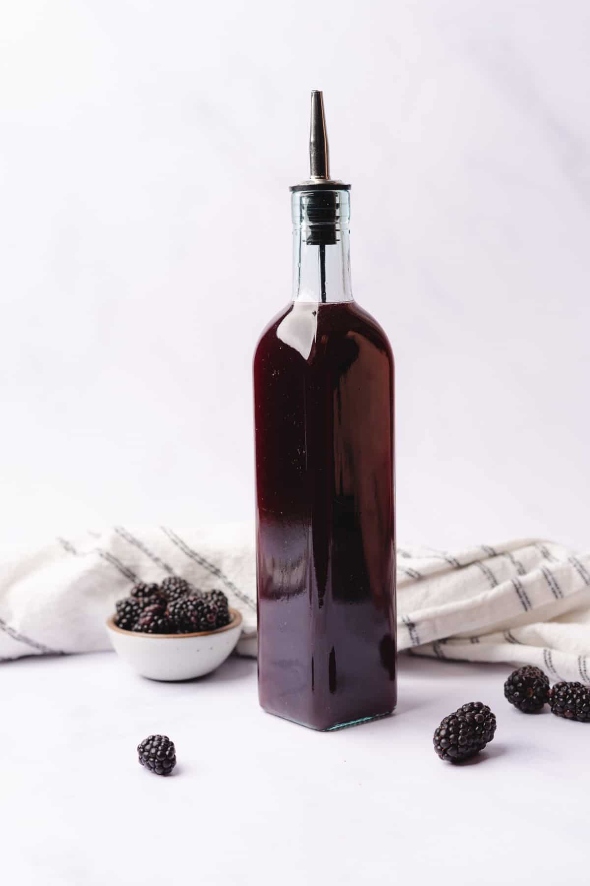 sugar free crème de mûre blackberry liqueur in a tall glass bottle 