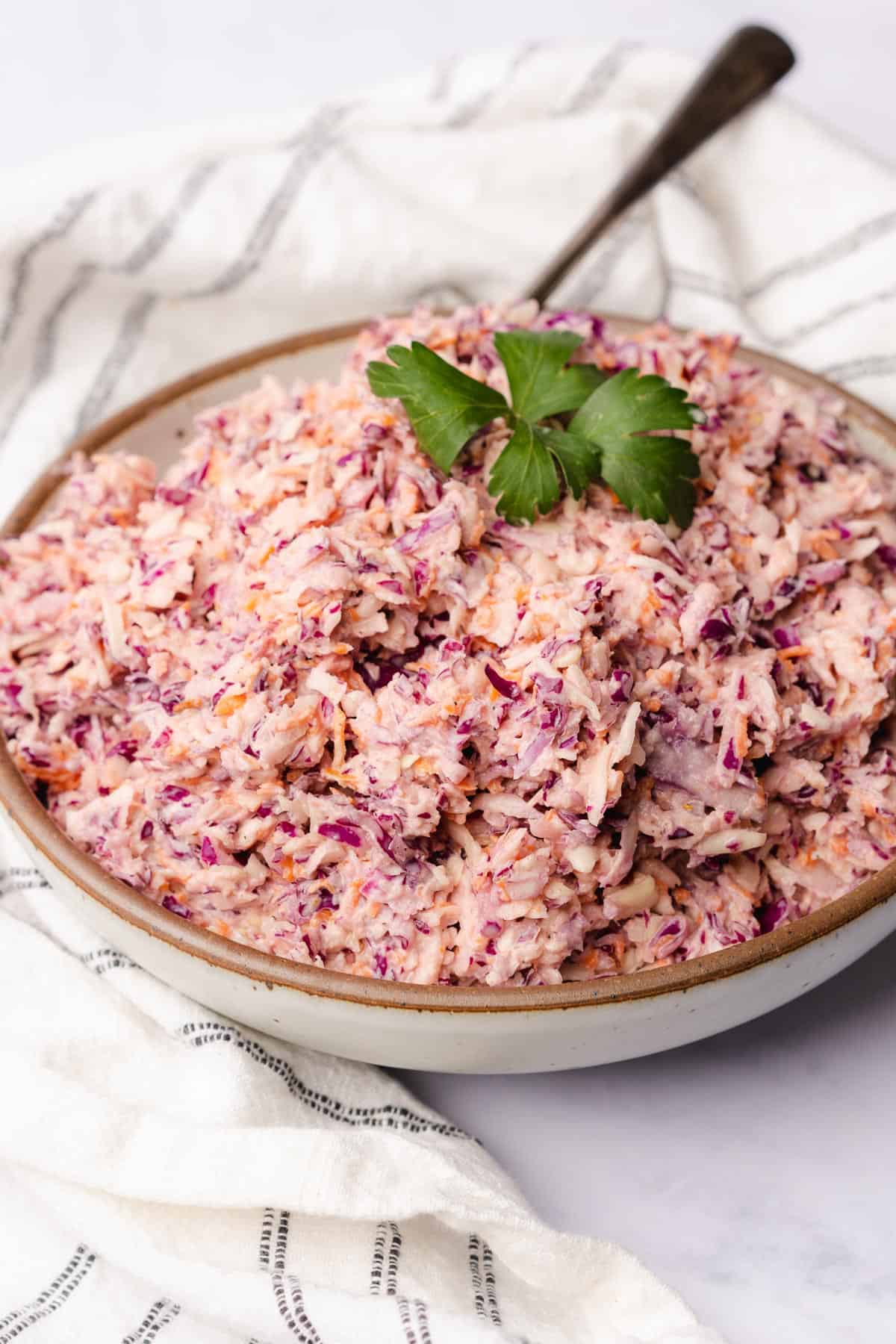 keto coleslaw recipe served with parsley in a large ceramic bowl