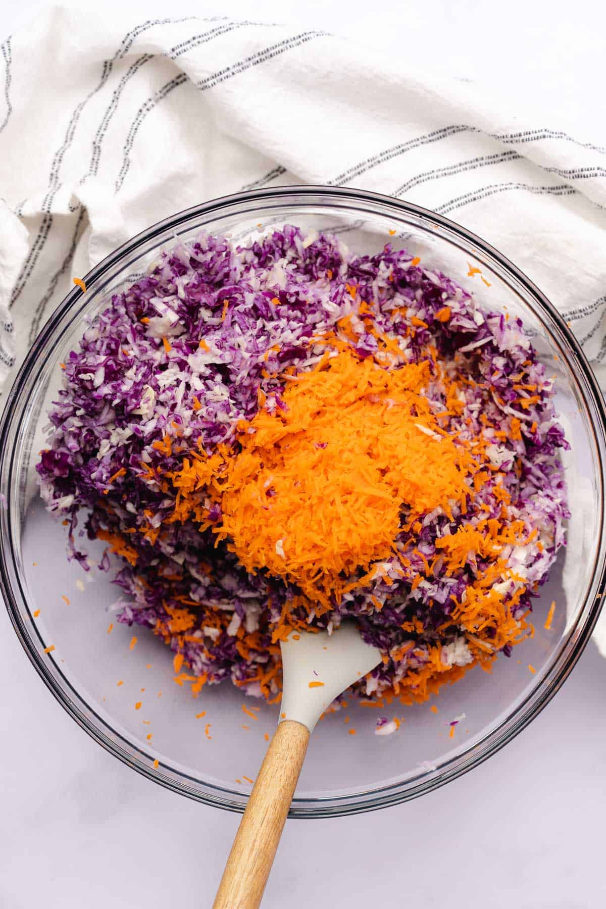 cabbage and carrots in a large mixing bowl