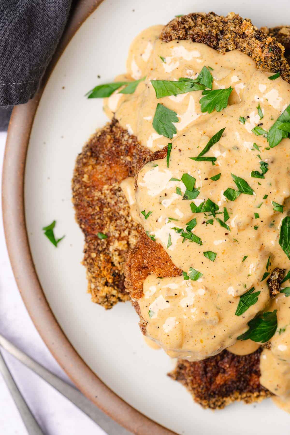 stack of pork chops smothered in creamy southern gravy