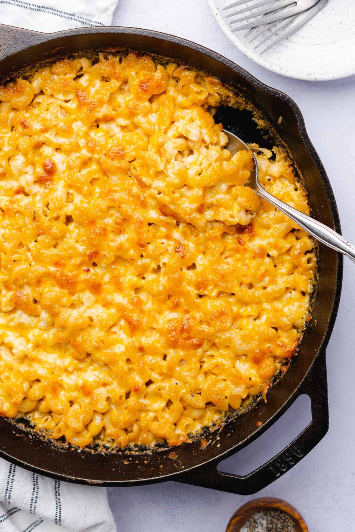 cast iron skillet filled with southern baked mac and cheese