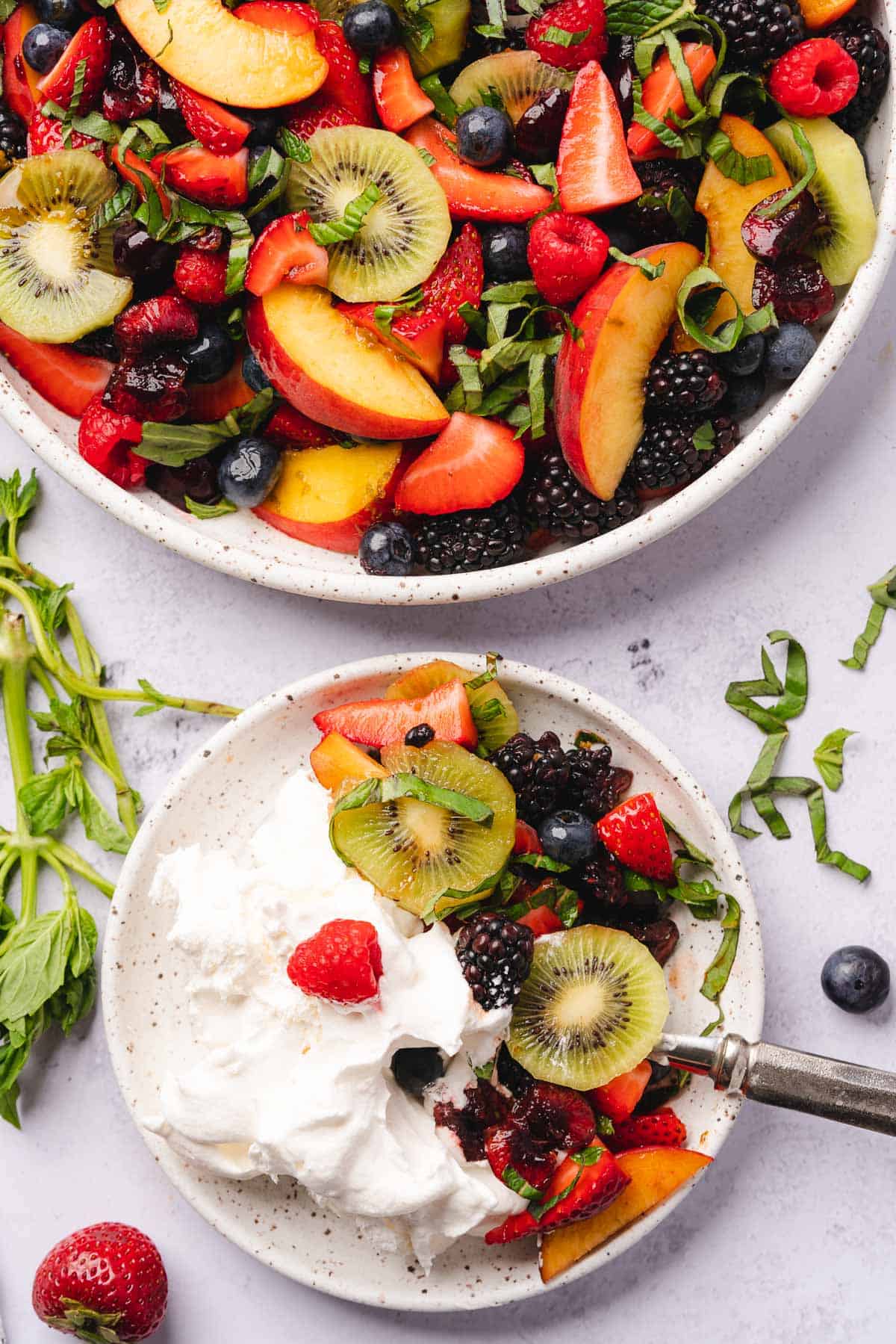 bowl of keto fruit salad with whipped topping on a small plate