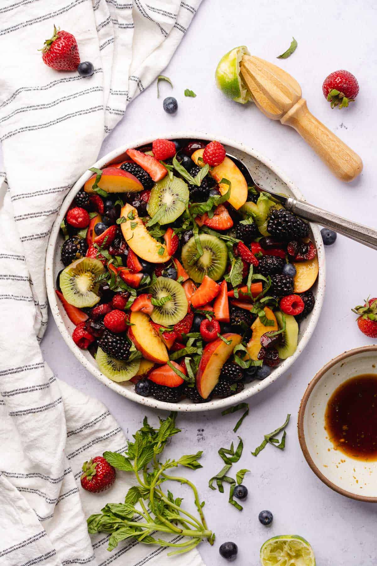 keto fruit salad with balsamic lime dressing nearby
