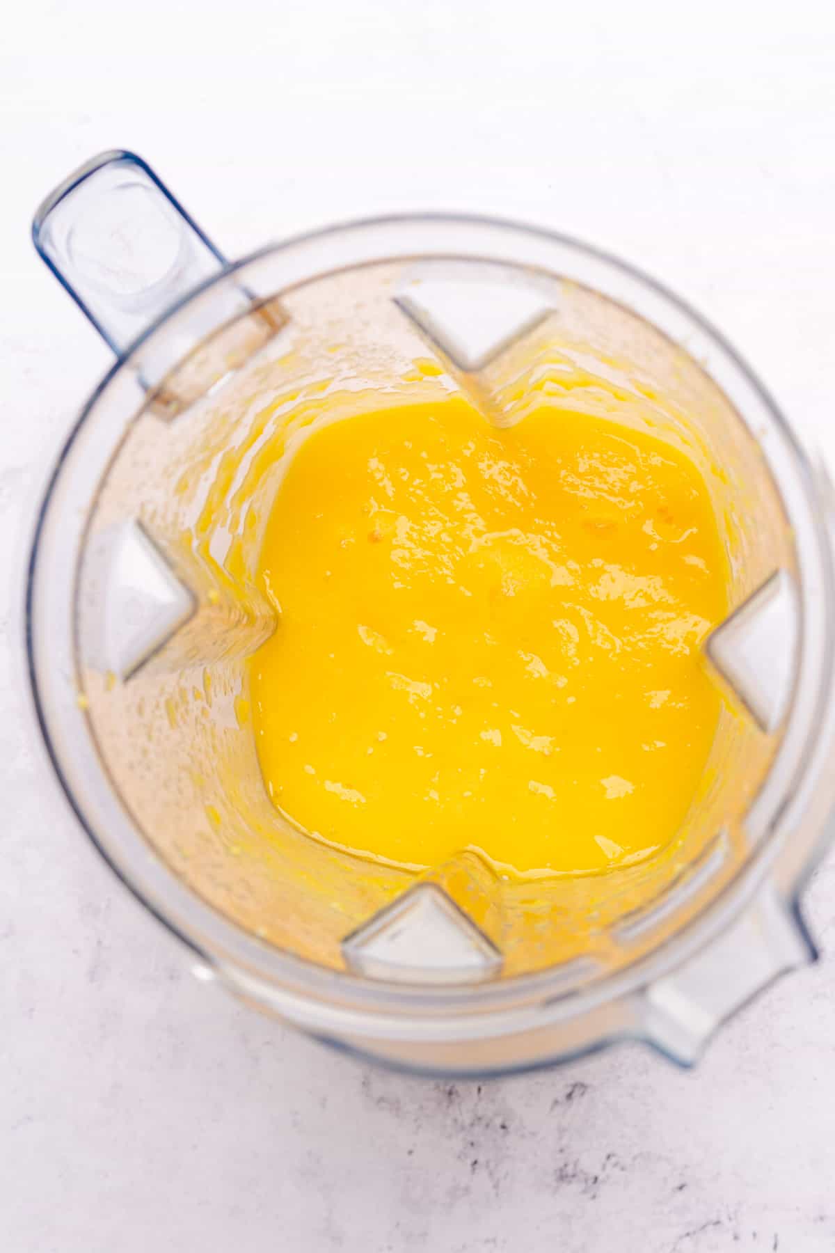 blended mango in a blender