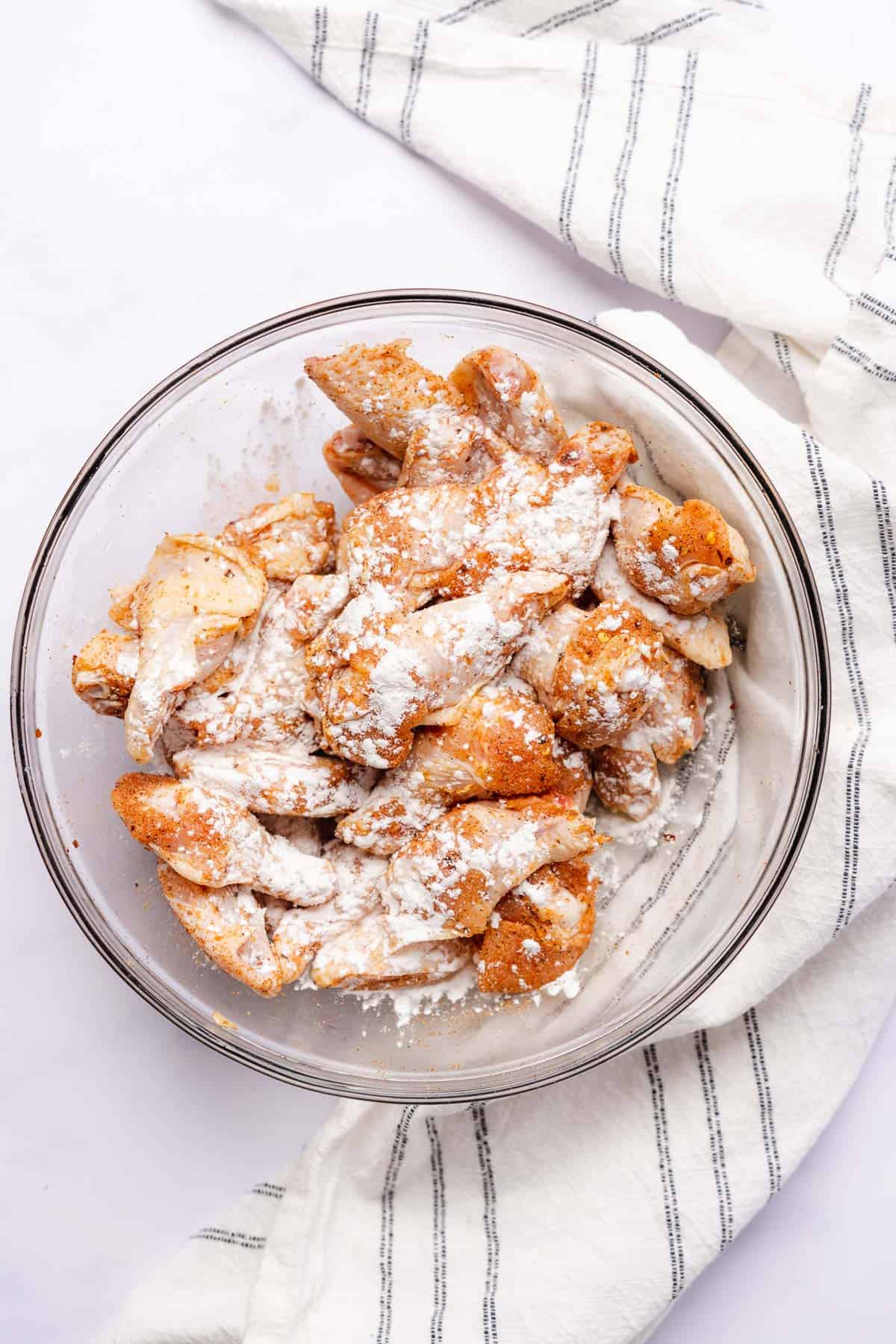 chicken wings in a bowl with baking powder