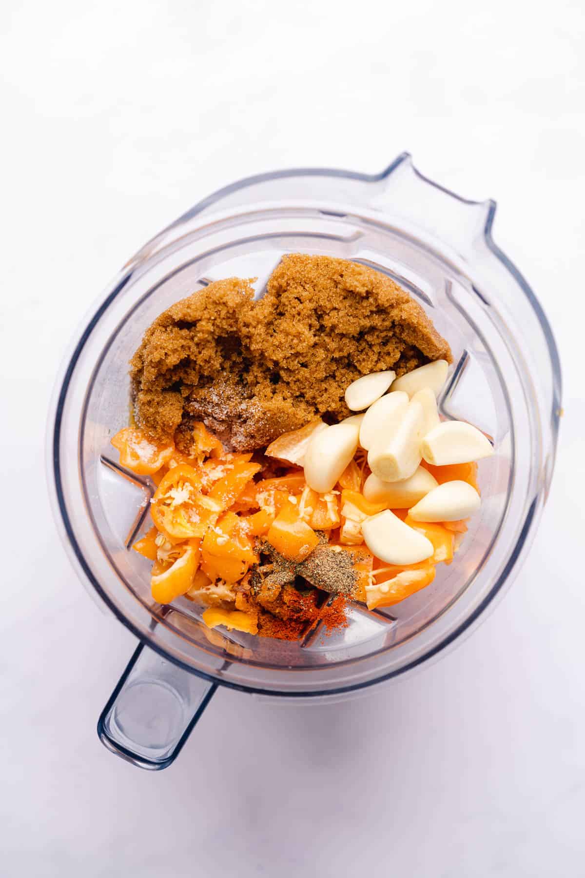 habanero peppers, garlic, onions, seasonings and brown sugar replacement in a blender