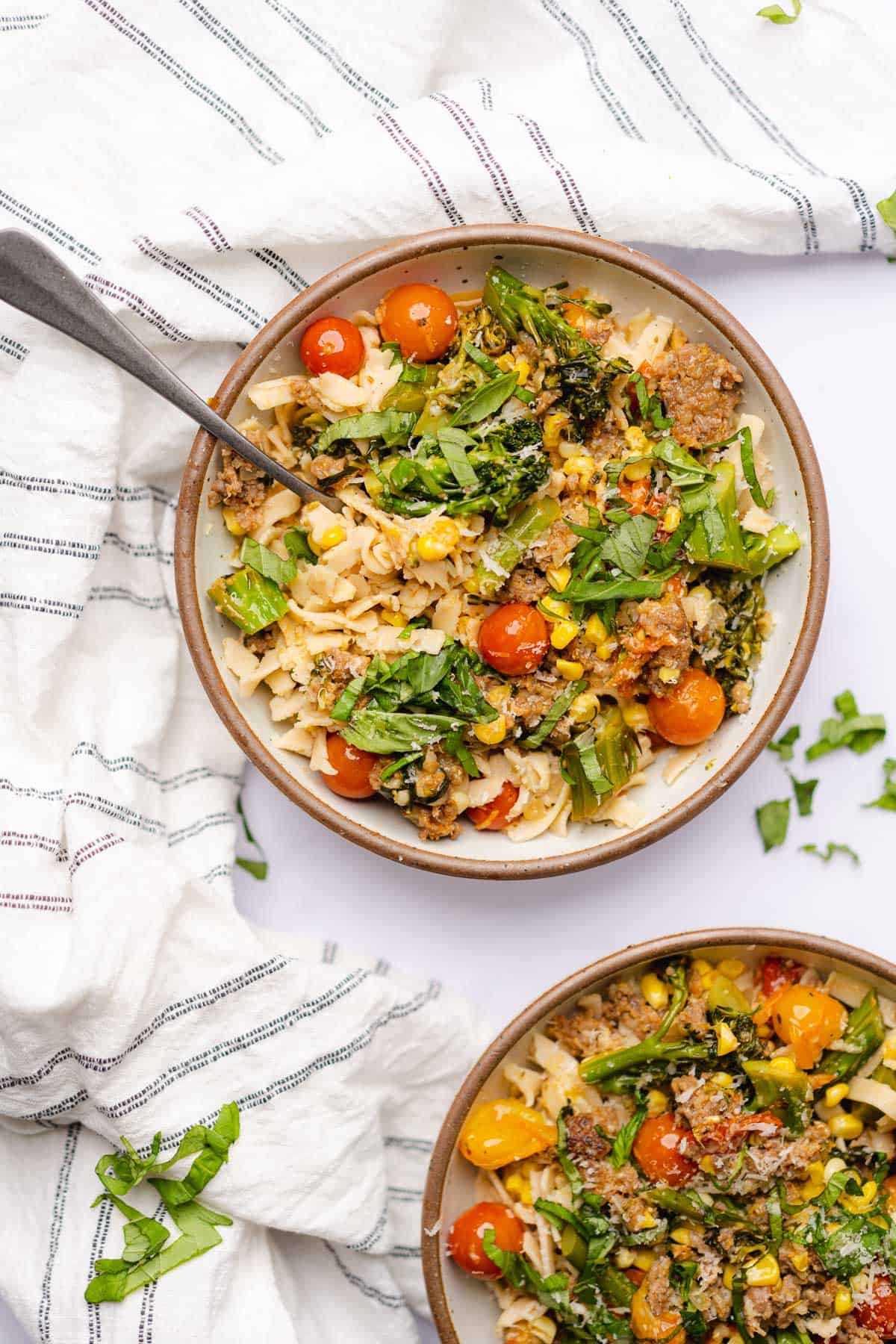 two bowls of sausage broccolini pasta