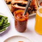 keto bbq sauce with homemade keto pork ribs next to a beer