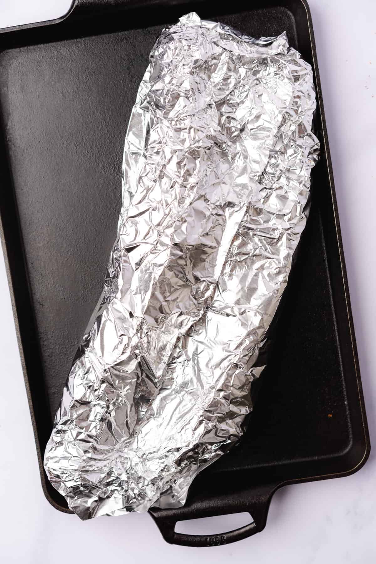 baby back ribs wrapped in aluminum foil 