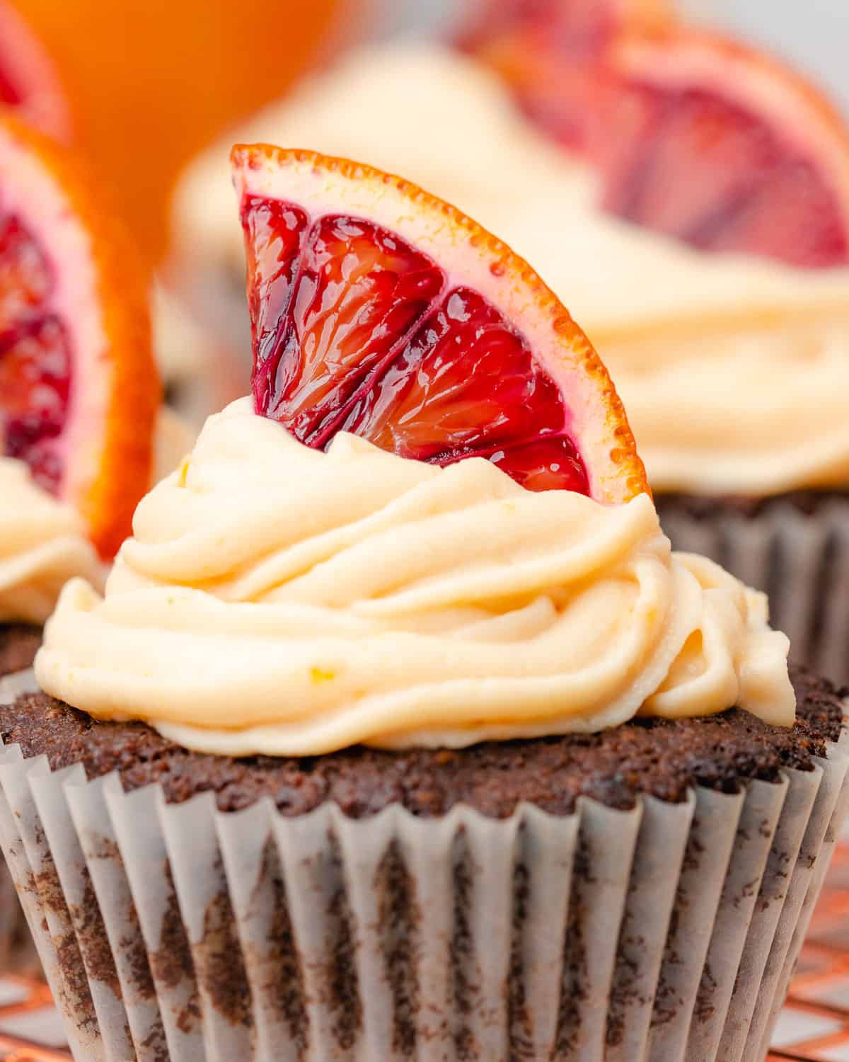 super pretty blood orange chocolate cupcakes with a blood orange frosting and topping