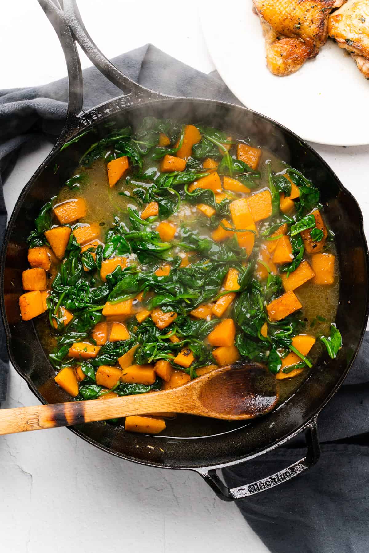 butternut squash and spinach cooking in bone broth