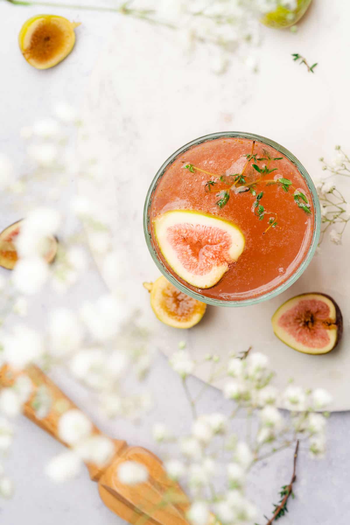 lovely fig cocktail with baby's breath flowers in the foreground