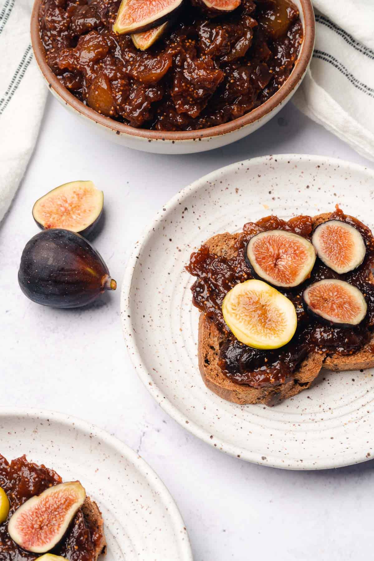 toast topped with figs spread with slices of fig 