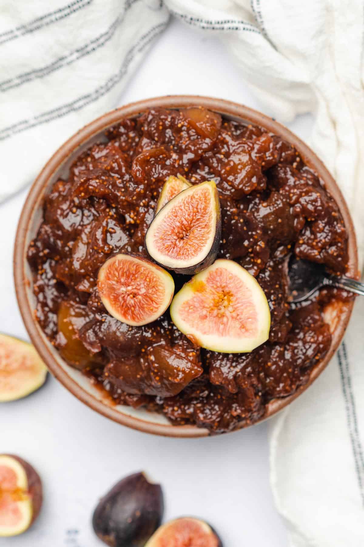 bowl of freshly made fig jam topped with black fission fig slices