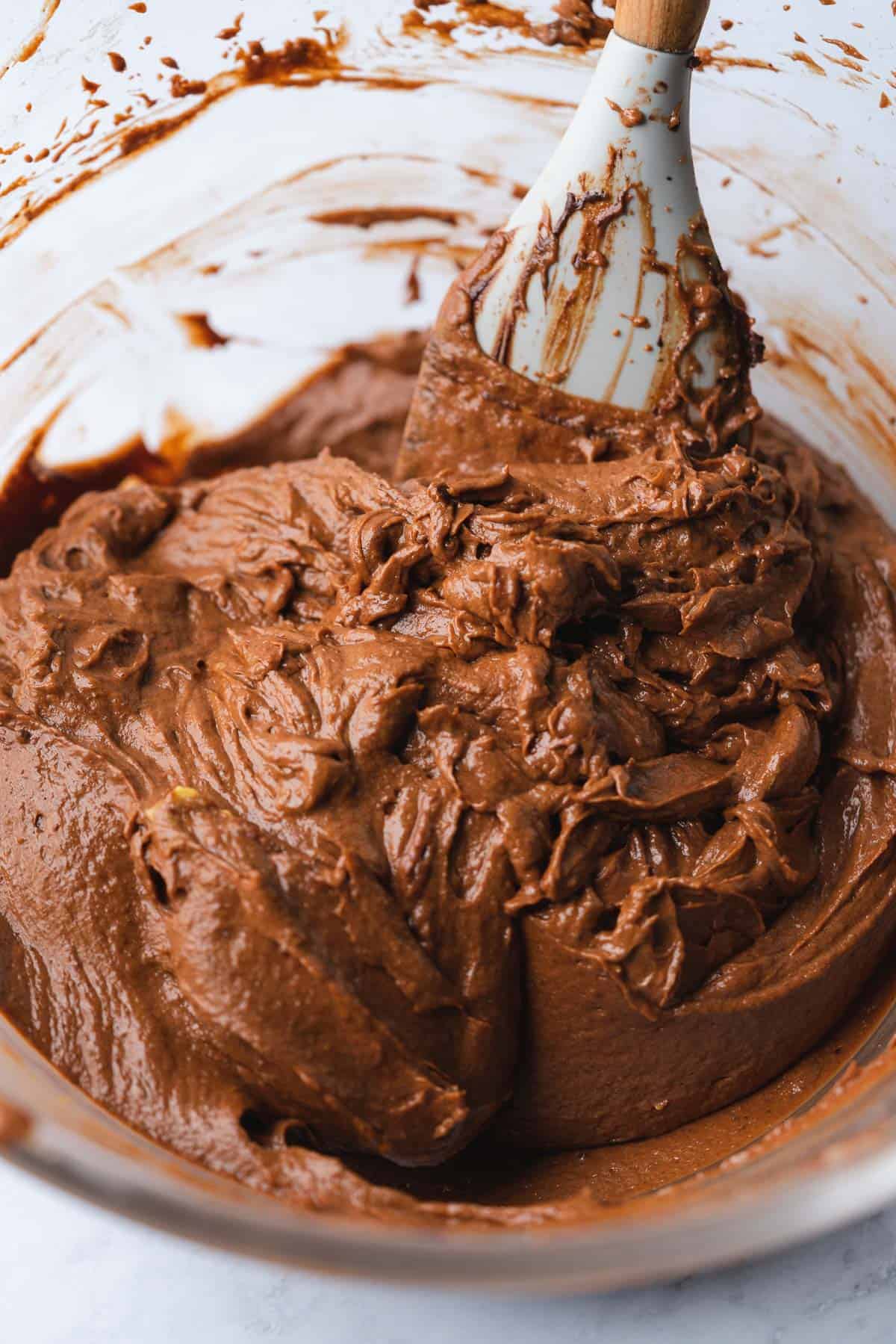 folding together chocolate brownie mix