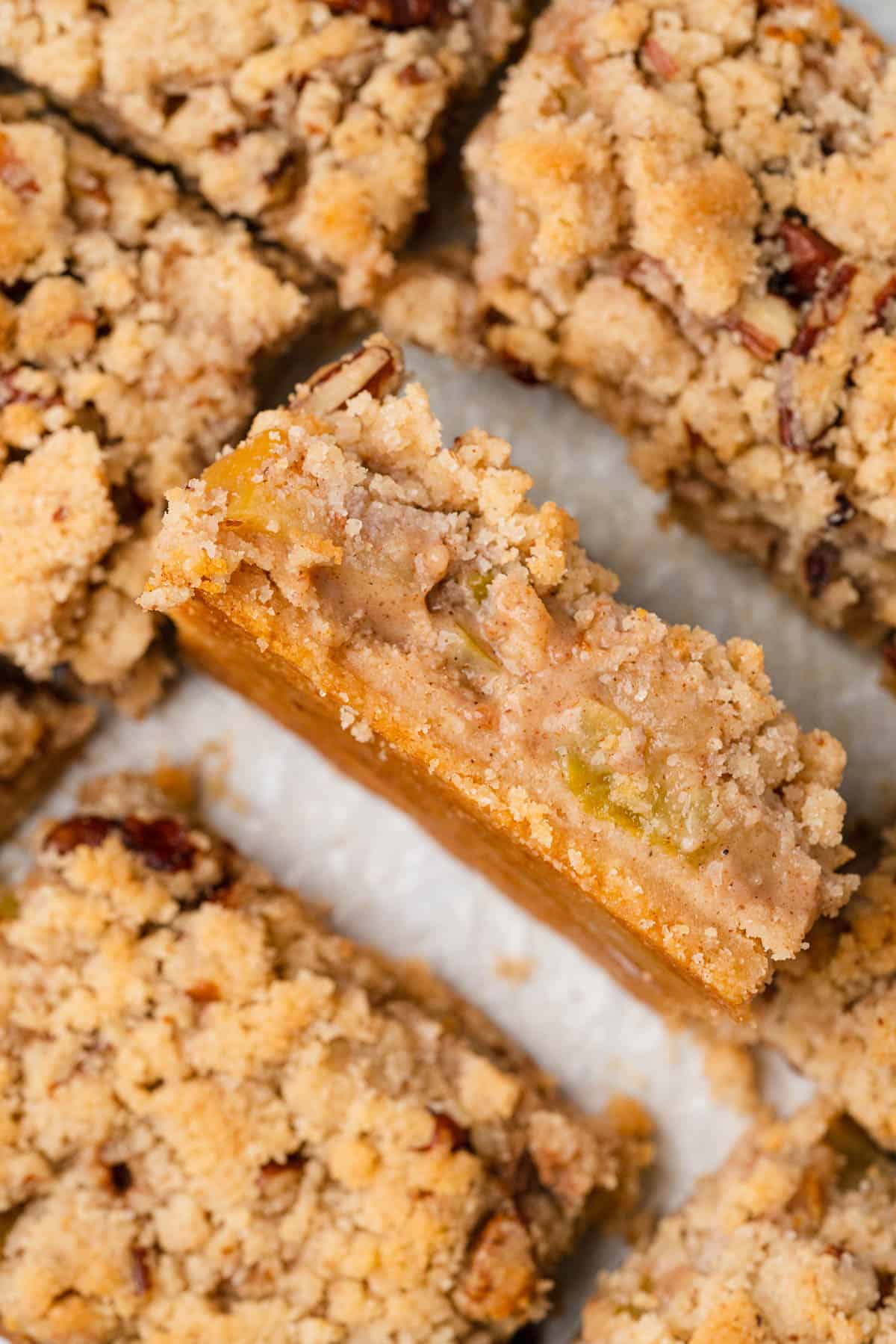 closeup shot of apple crumble bars in a baking sheet
