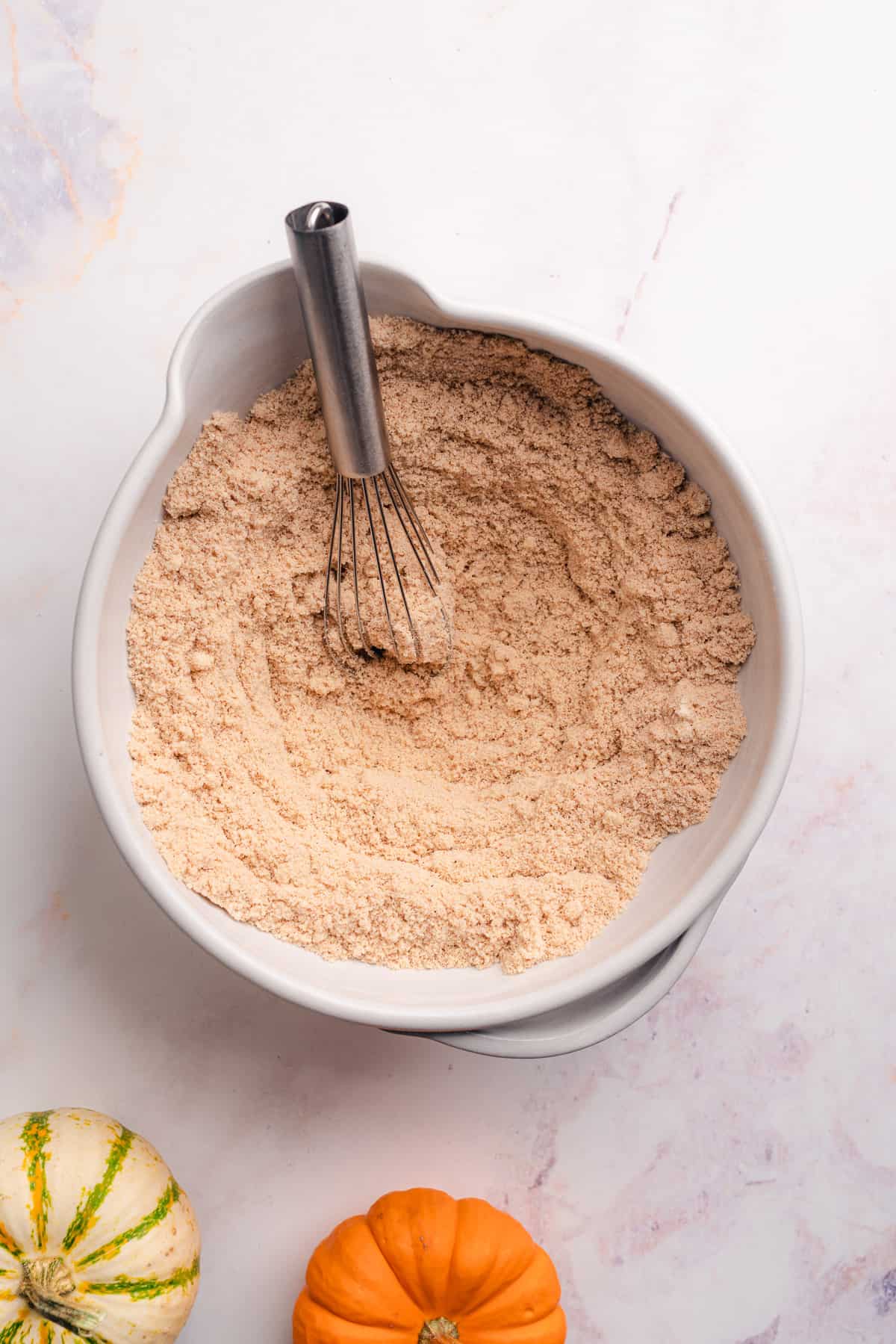 whisked almond flour in a ceramic bowl 