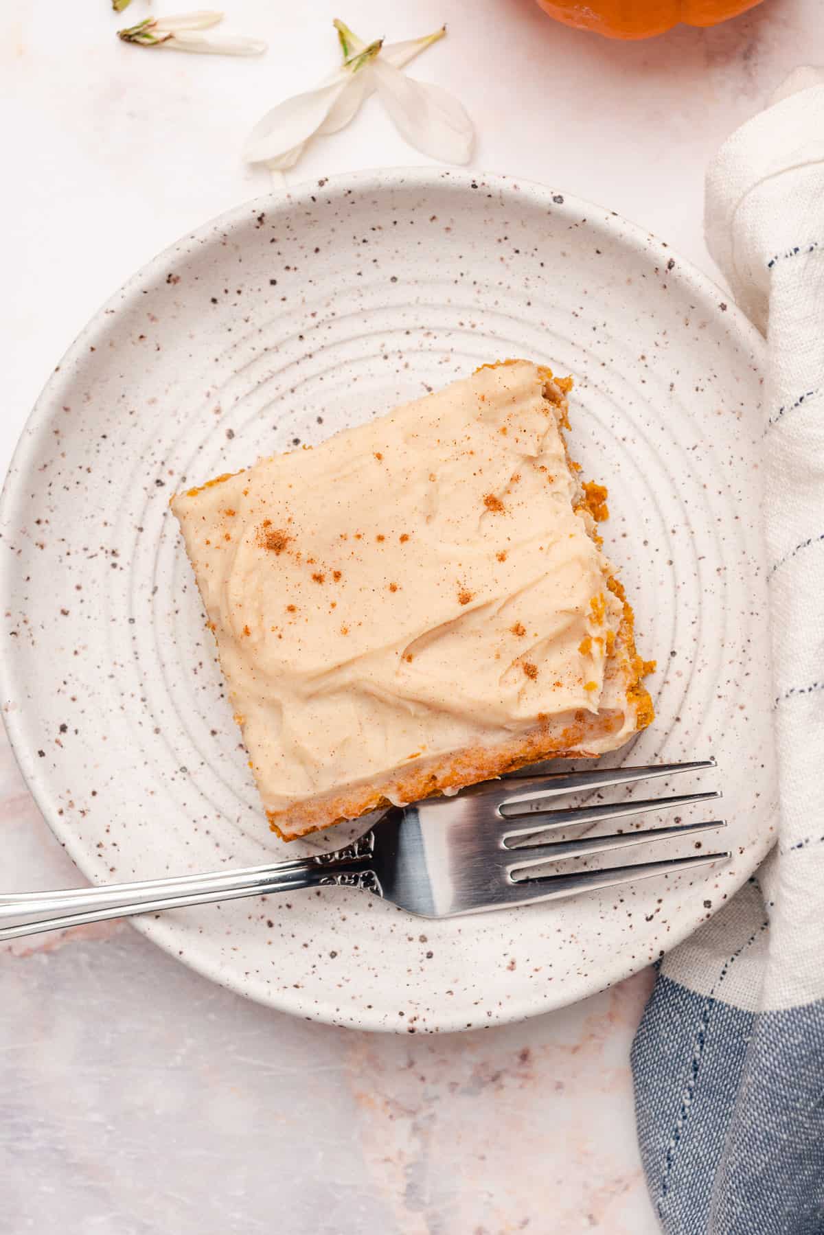 piece of a keto pumpkin bar on a plate with a fork