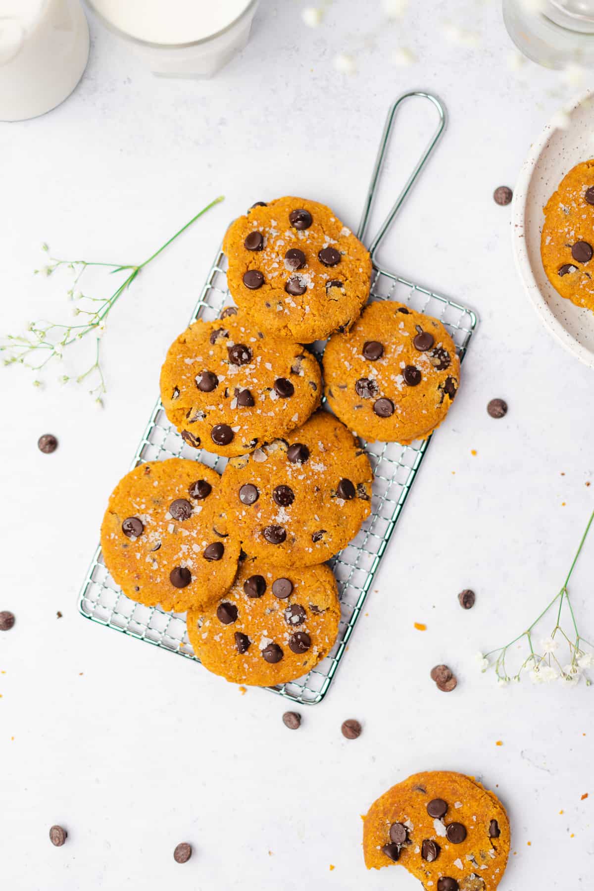 flat lay of keto pumpkin chocolate chip cookies on a wire baking sheet